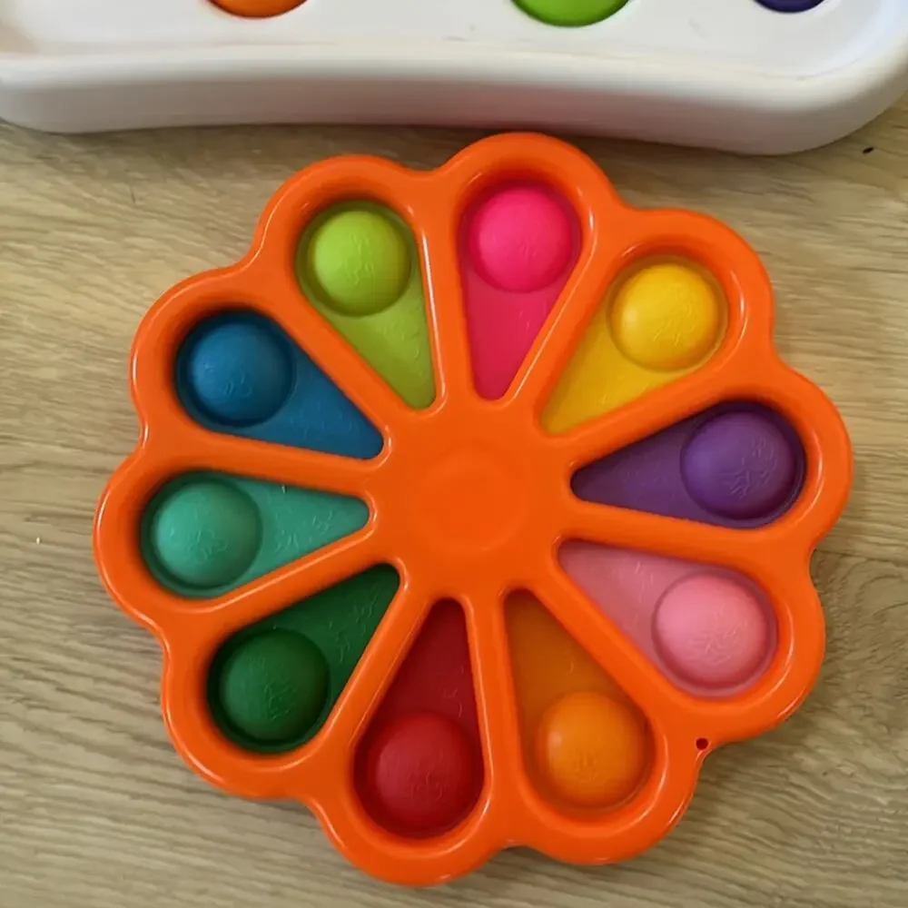 Hard plastic dimple pop perfect for babies sanitizable like new 4 total fodgets